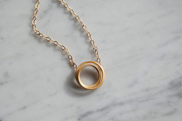 Eclipse gold pendant necklace for women