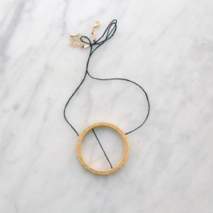 Saturn gold and steel pendant necklace